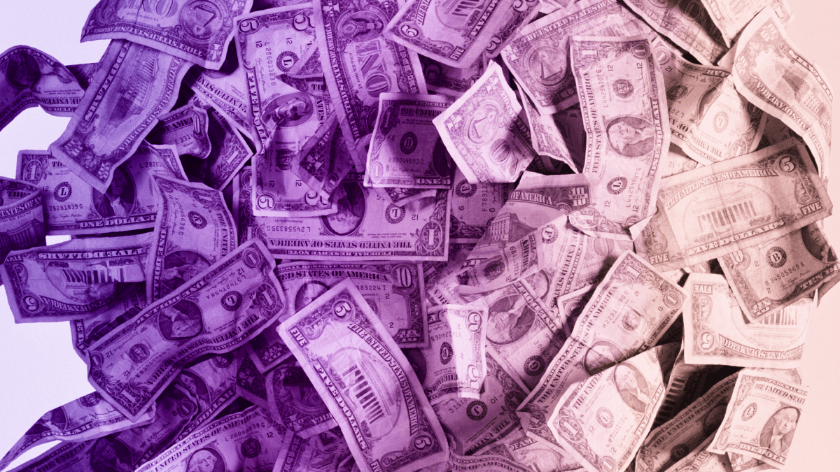 A heap of US dollar bills in various denominations, tinted with a vibrant purple-to-pink color gradient.